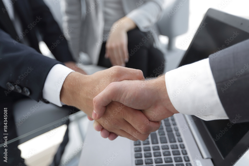 Two confidence businessman shaking hands close-up Two confidence businessman shaking hands close-up