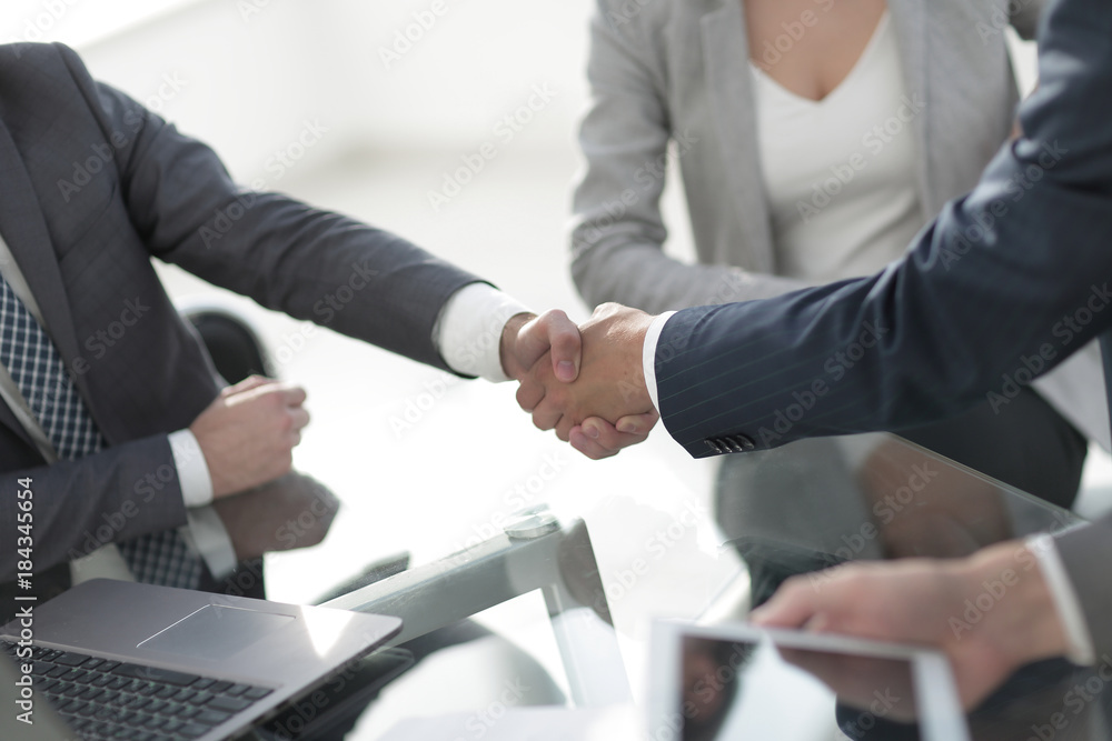 confident handshake of business partners confident handshake of business partners