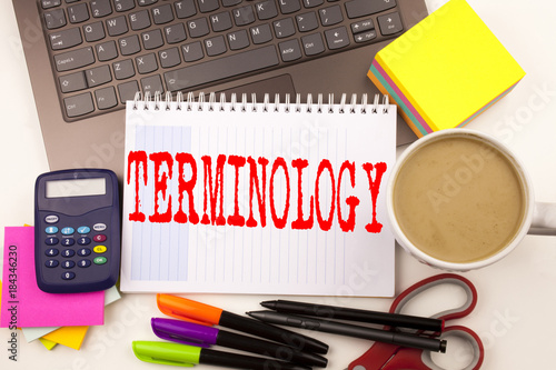 Word writing Terminology in the office with laptop, marker, pen, stationery, coffee. Business concept for Medical Legalistic Terminological Workshop white background with copy space