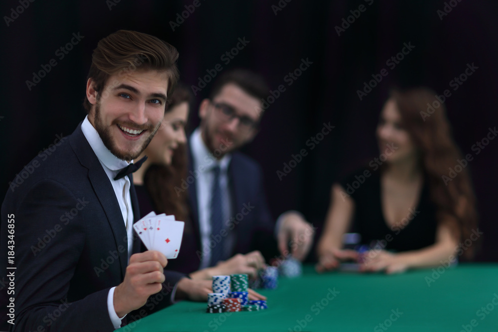 smiling business man showing four aces smiling business man showing four aces