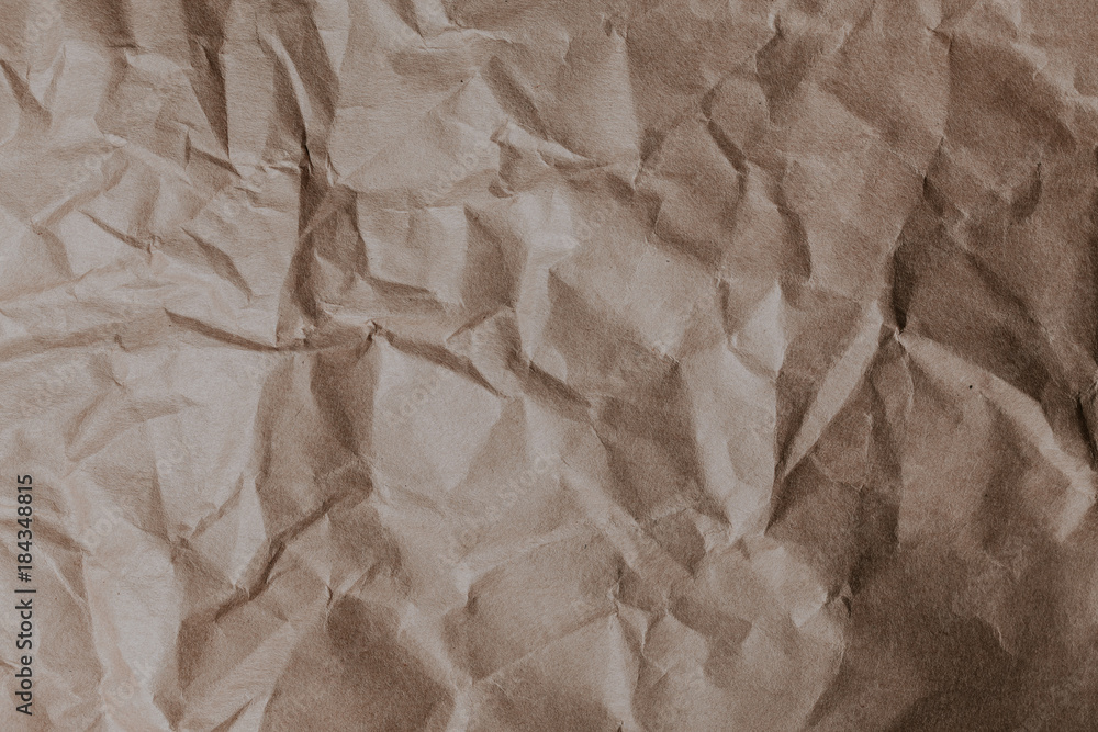 Wrinkled brown paper pattern background. Wrinkled brown paper pattern background.