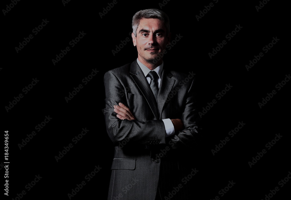Closeup of a smiling man isolated over black background Closeup of a smiling man isolated over black background