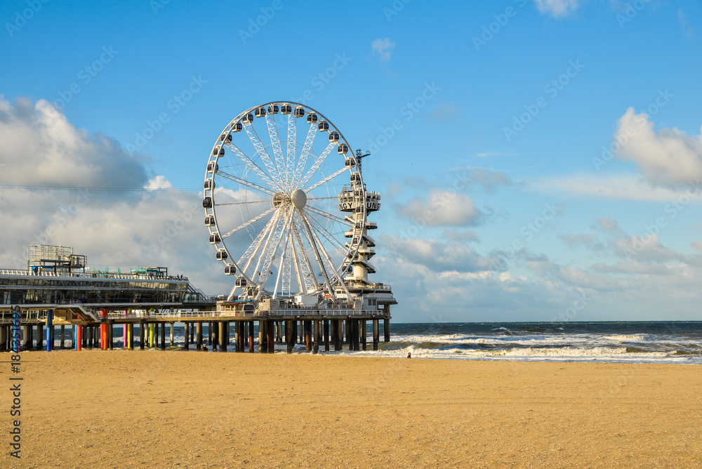 Beautiful day at Scheveningen beach, Netherlands with famous Pier in the background