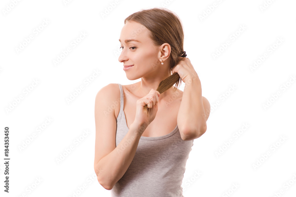 Beautiful young woman hair holding on to the tail Beautiful young woman hair holding on to the tail