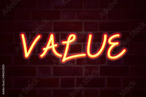 Value neon sign on brick wall background. Fluorescent Neon tube Sign on brickwork Business concept for Importance Use Benefit Principles Morals Ethics 3D rendered