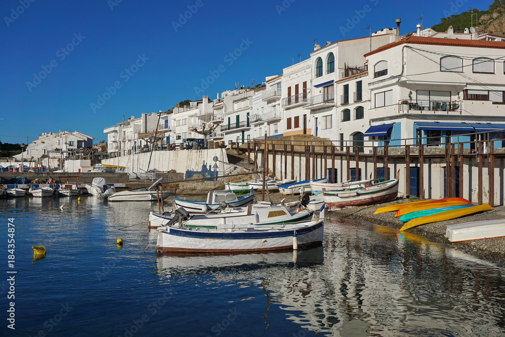 Spain Catalonia Mediterranean village El Port de la Selva with boats on the sea shore, Costa Brava, Alt Emporda