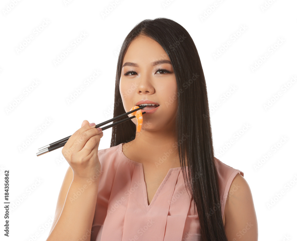 Beautiful Asian woman eating shrimp on white background Beautiful Asian woman eating shrimp on white background