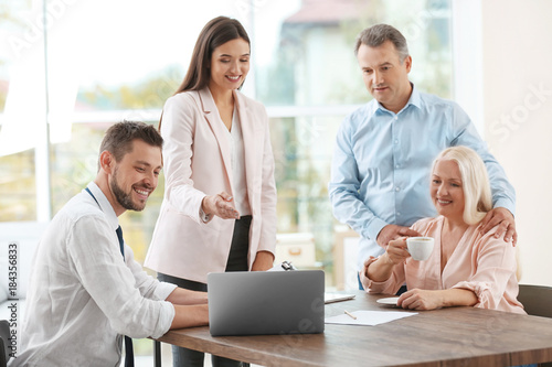 Insurance agents consulting...