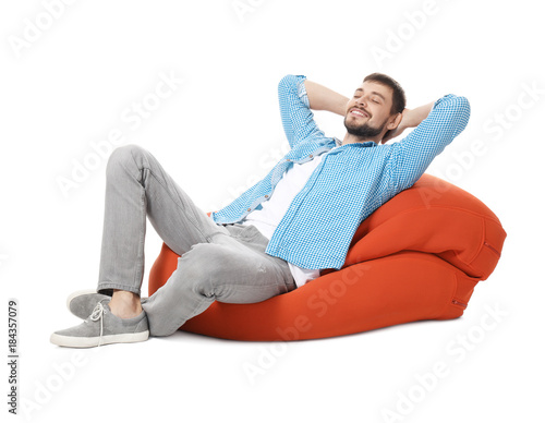Handsome man relaxing on lo...