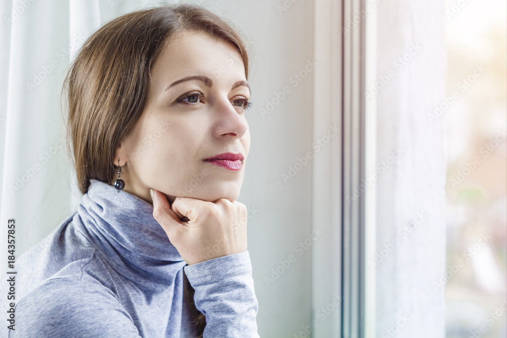 A young woman thinks thoughtfully. A young woman thinks thoughtfully.