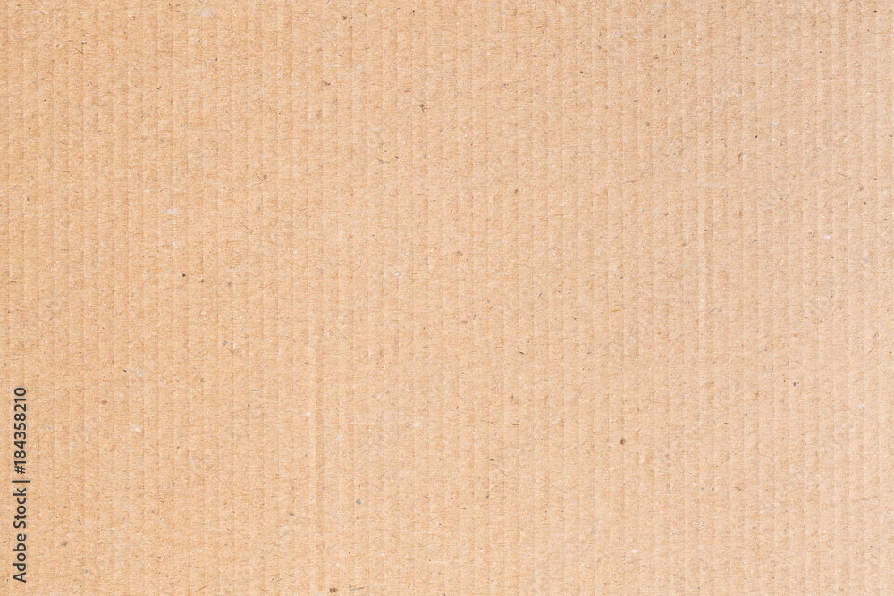 Fototapeta premium The brown paper box is empty, the corrugated surface of the abstract background.