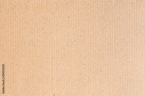 The brown paper box is empty, the corrugated surface of the abstract background.