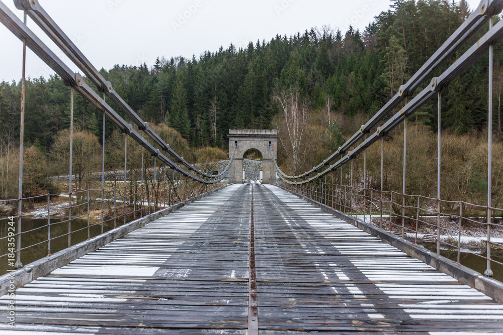 Obraz premium Stadlecky chain bridge over the river Luznice in the Czech republic. National Technical Monument.