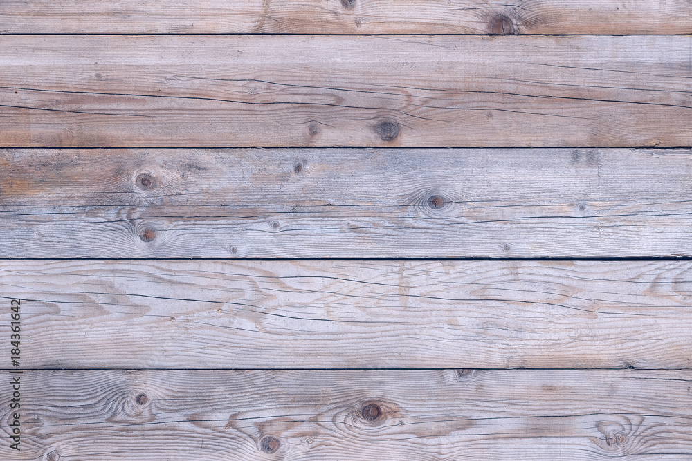 Fototapeta premium Old faded worn weathered distressed damaged stained grunge wood grain planked wall rustic background texture photo