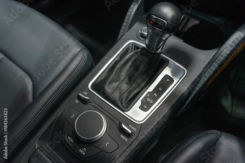 automatic gear stick of a modern car, car interior details © navintar