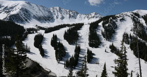 Winter Arapahoe Basin Ski Area spring skiing. Alpine ski area in the Rocky Mountains west of Denver. Loveland Pass road crosses peak at 11,990 feet on the Continental Divide. Ski resorts. photo