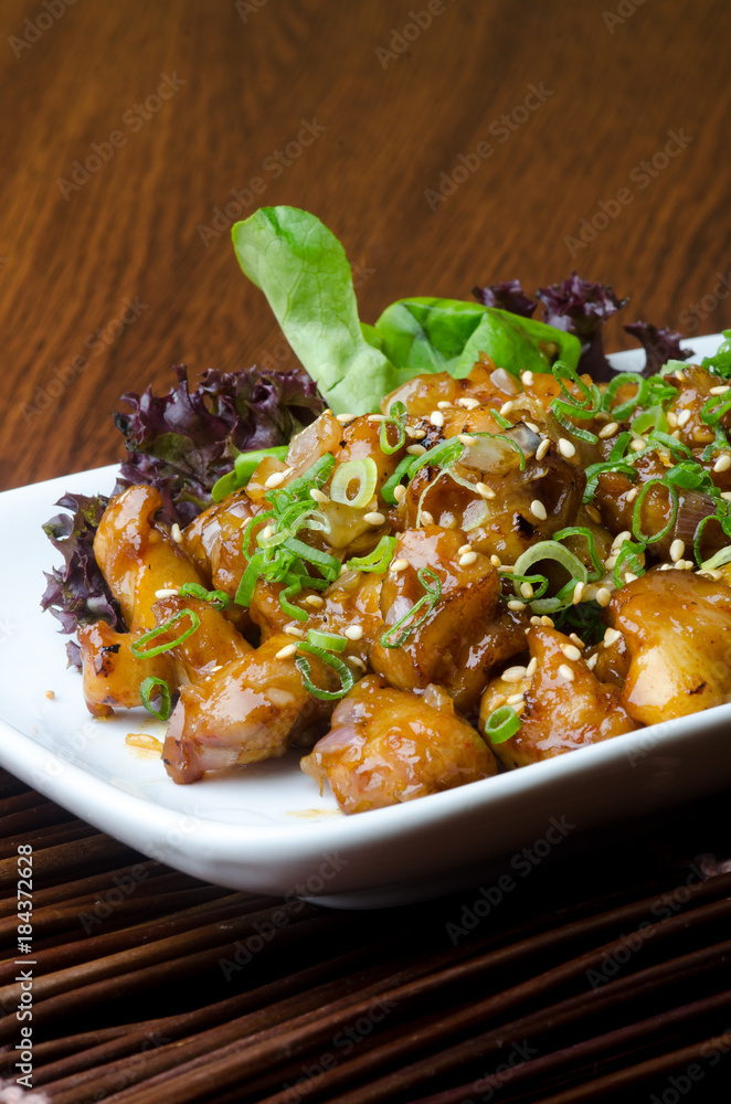 japanese cuisine. fry sauce chicken on the background japanese cuisine. fry sauce chicken on the background