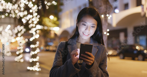 Woman use of cellphone in city