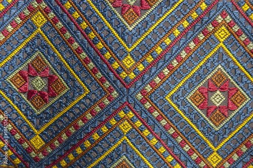 Cotton ancient textiles / Thailand folk textiles : Traditional textiles made from natural pigments. a pattern of woven fabric that is unique to Thailand