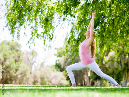 Young woman doing yoga in the park