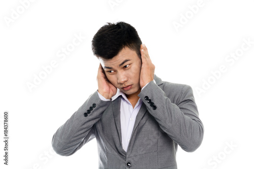 Portrait of a business man having a headache. Isolated on white background