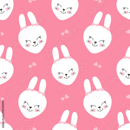 Cute baby pattern with little bunny. Cartoon animal girl print vector seamless. Sweet pink background with white rabbit faces and hearts for children fabric, home textile, nursery or birthday party.