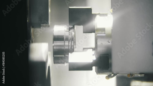 Replacing and placing the metal parts in the lathe for machining photo