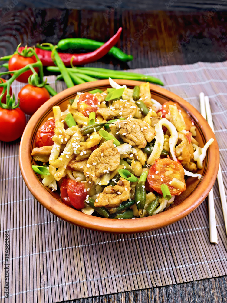 Noodles wok Thai in clay plate on board Noodles wok Thai in clay plate on board