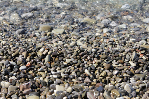 pebble beach with clear water of the sea