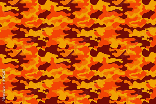 Camouflage pattern background. Classic clothing style masking camo repeat print. Fire orange brown yellow colors forest texture. Design element. Vector illustration.