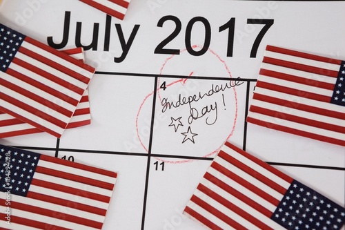 American flags with fourth of july calendar