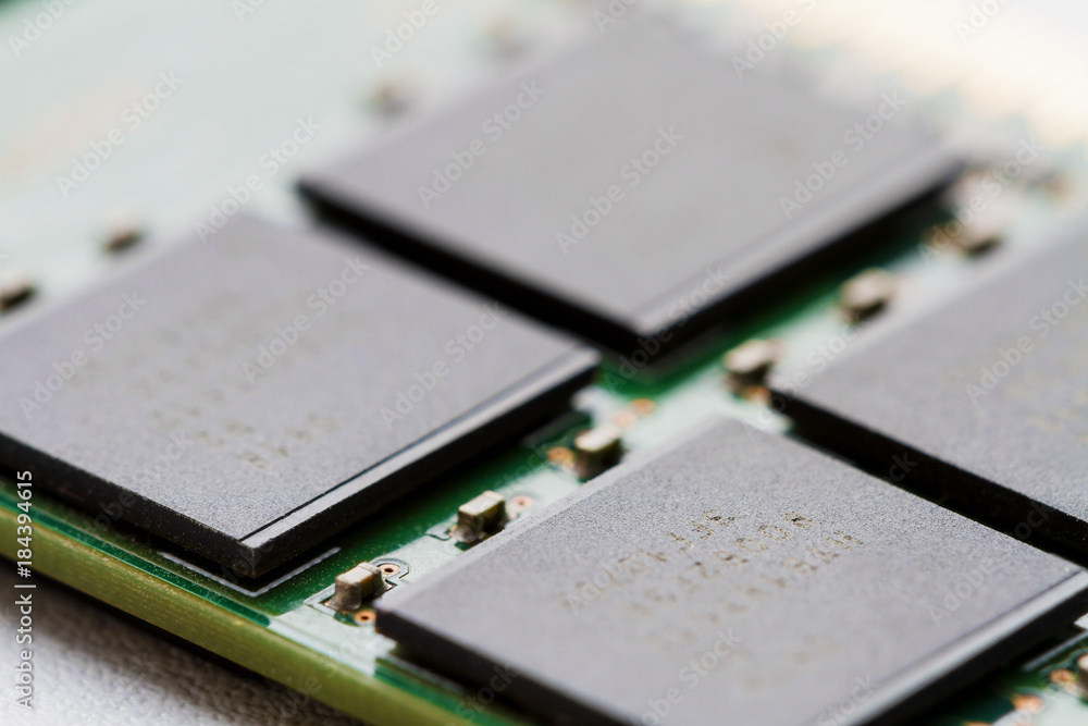 A part of computer RAM memory module. Closeup, selective focus, backlight A part of computer RAM memory module. Closeup, selective focus, backlight