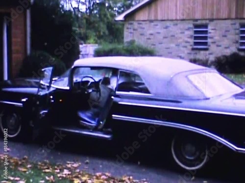 Five year old boy climbs into family convertible to go for summer drive in 1966