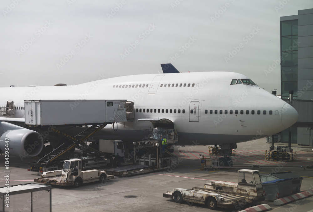 Passenger plane in the airport. Aircraft maintenance. Passenger plane in the airport. Aircraft maintenance.