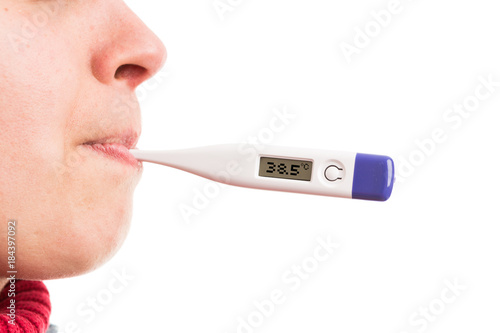 Woman mouth holding high  temperature digital thermometer