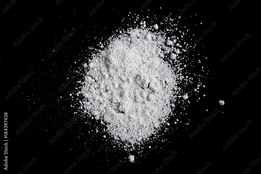 White powder isolated on black background, dust or powder texture White powder isolated on black background, dust or powder texture