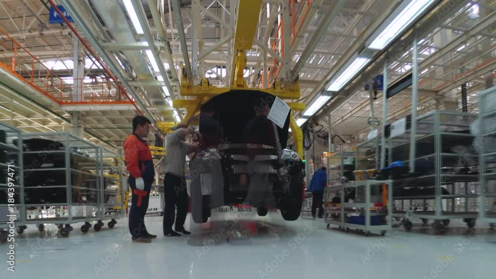 Automobile plant, modern production of cars, car body assembly process ...