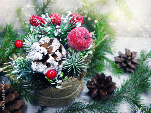 christmas decoration winter berries and snow on wooden background