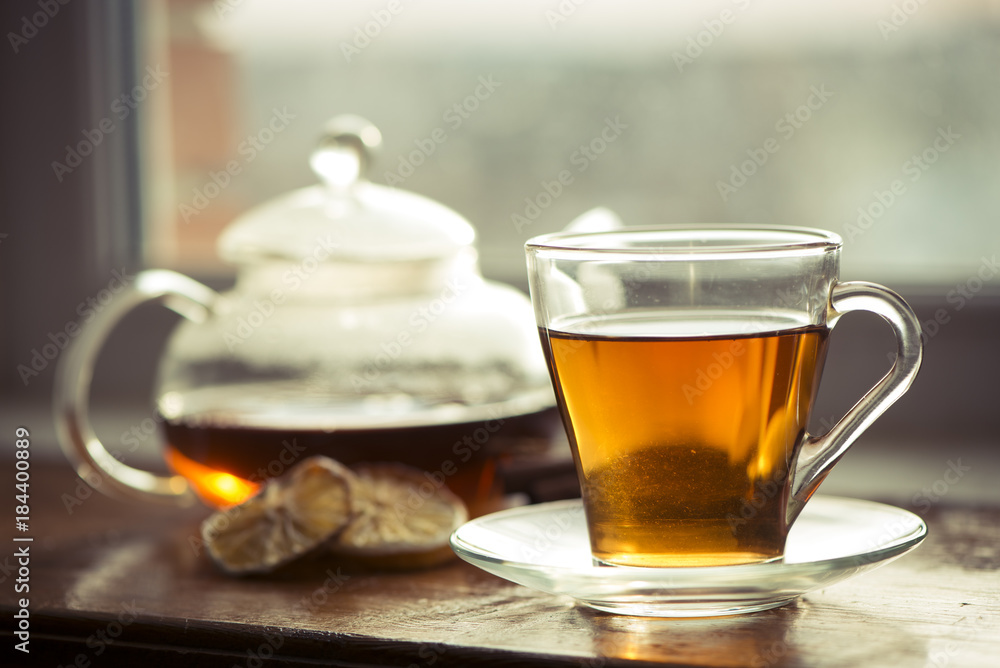 Hot tea cup on a frosty winter day window background Hot tea cup on a frosty winter day window background