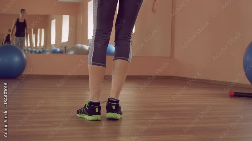 fit woman workout lateral lunges.muscular blonde girl standing in gym. young athlete wearing bright sportswear training indoors. fit woman workout lateral lunges.muscular blonde girl standing in gym. young athlete wearing bright sportswear training indoors.