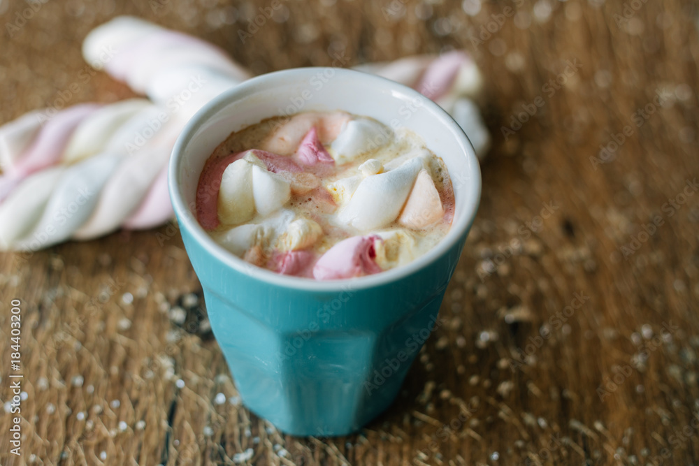 Coffee with marshmallow in a light blue cup Coffee with marshmallow in a light blue cup