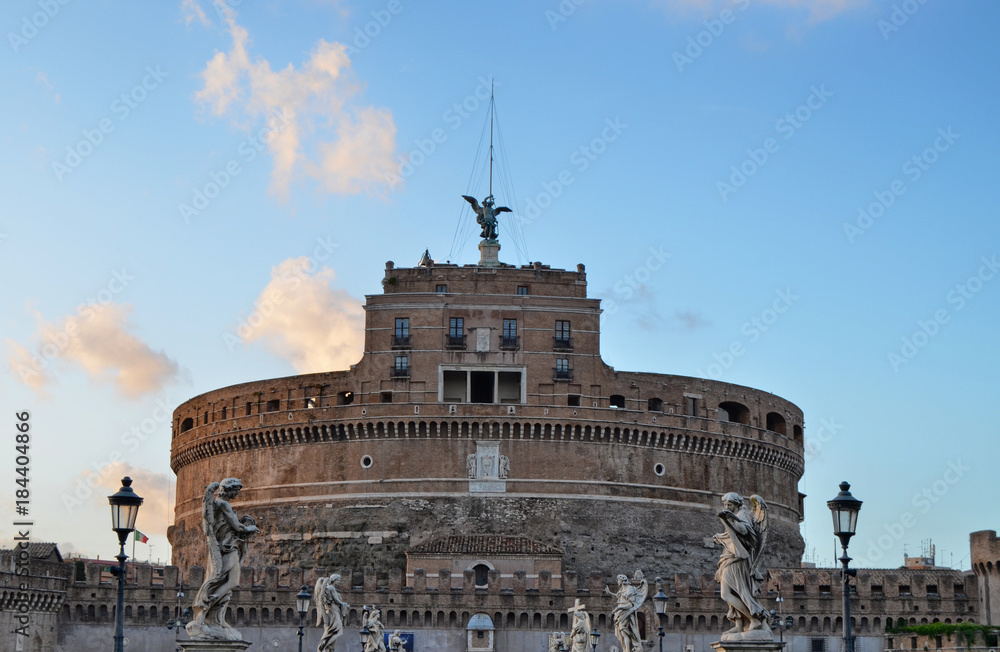 Castle of San Angelo Castel Sant Angelo and Ponte Sant Angelo bridge over the Tiber river, Rome, Italy. Statues on the sides and cloudy sky. Photo of 14 August 2014 at 8.00 pm Castle of San Angelo Castel Sant Angelo and Ponte Sant Angelo bridge over the Tiber river, Rome, Italy. Statues on the sides and cloudy sky. Photo of 14 August 2014 at 8.00 pm