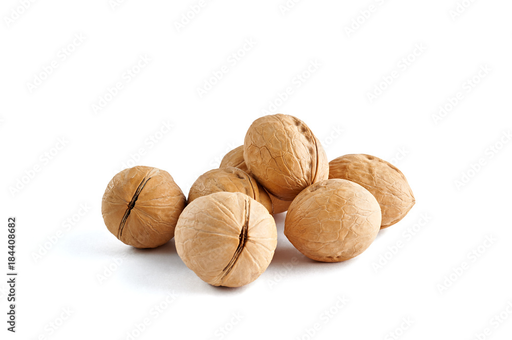 Handful of walnuts isolated on white background. Handful of walnuts isolated on white background.