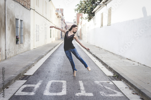 Classical ballerina dancing on the street dressed in casual clothes © txemag