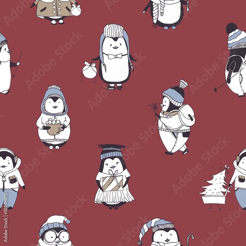 Seamless pattern with funny baby penguins wearing various winter clothes on r...