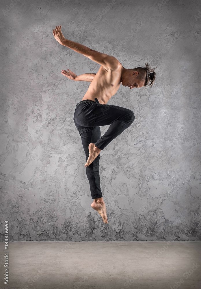 Fototapeta premium Man dancer, in beautiful dynamic jump action figure on the grung
