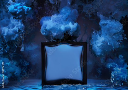 The  bottle of man's perfume stands in a water wave with clubs of blue paint around the bottle
