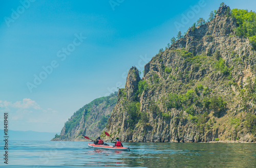 Mеn kayaking on Lake Baikal. Landscape. Siberia. © Andrew