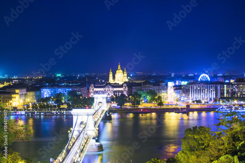 Beautiful view of the Basilica of Saint Istvan and the Szechenyi chain bridge across the Danube in Budapest, Hungary © marinadatsenko