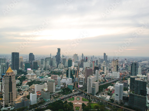 Bangkok skyline with green park sunset